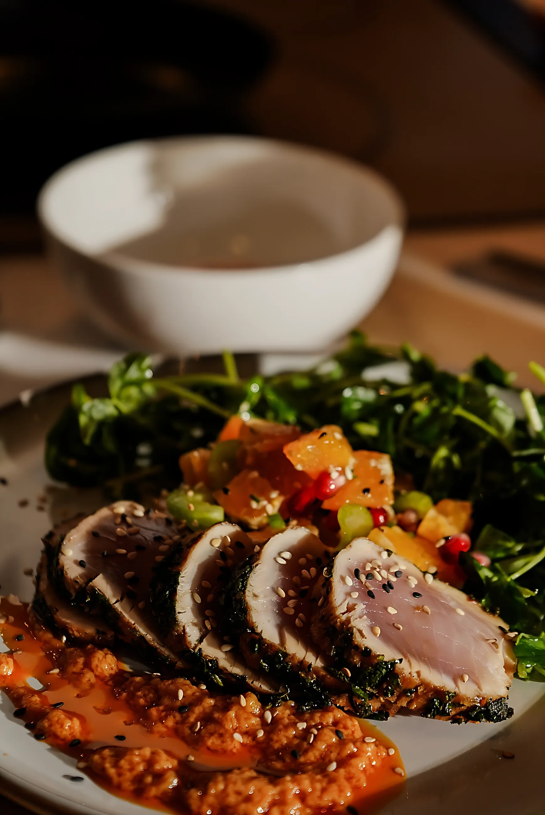 Seared tuna over greens with a citrus dressing