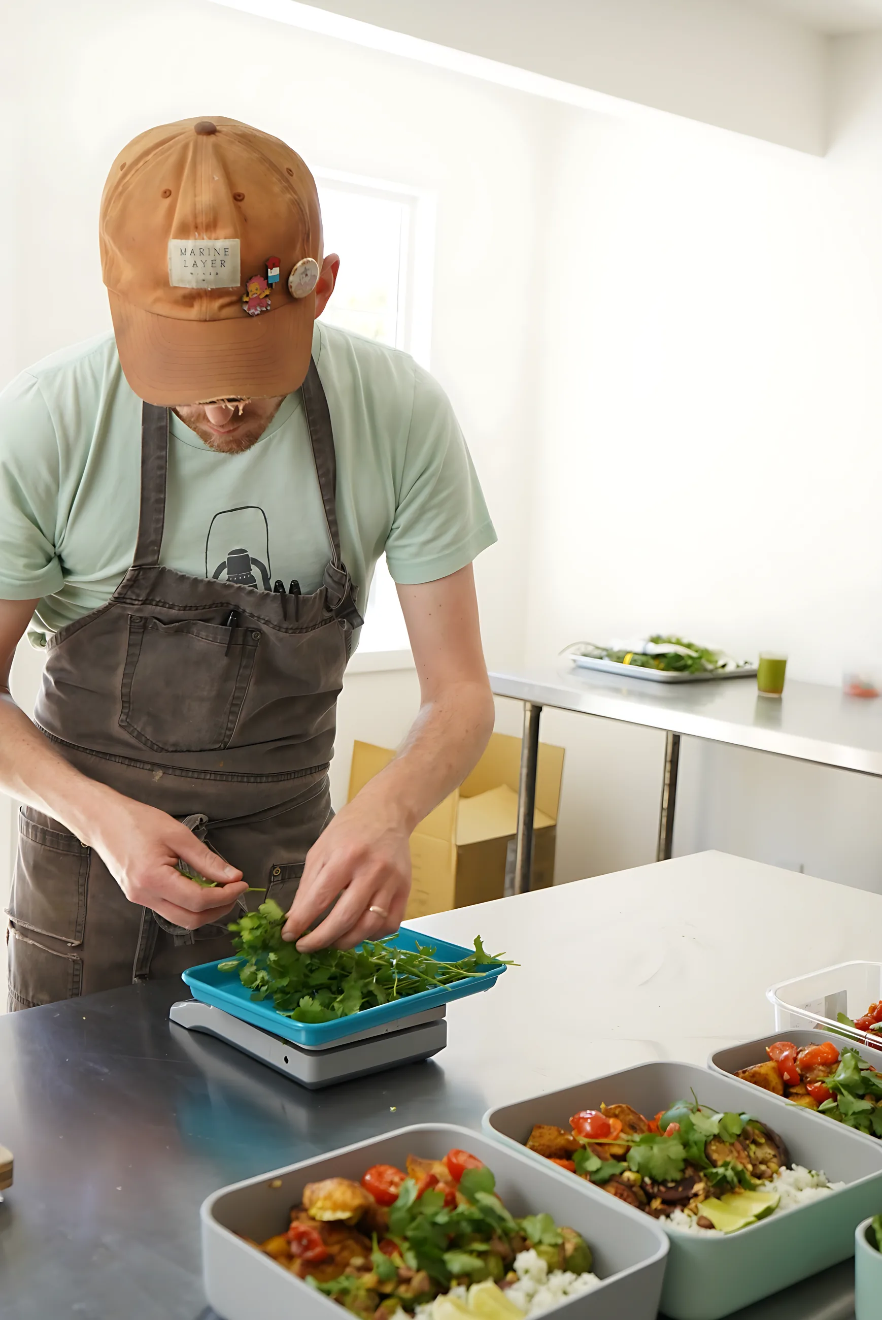 A cook packing containers in the Culiene kitchen
